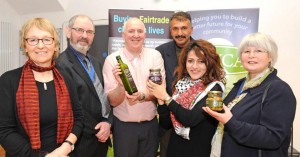 Richard Dillon (with bottle of Zaytoun olive oil) with olive farmers and Keighley dignitaries