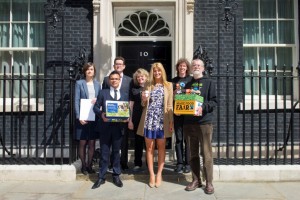 Karen Palframan (second on the right) and Cheska Hull (third on the right) join in the handover at Number 10. Credit: Matt Crossick (Fairtrade Foundation)