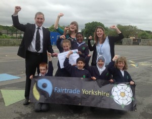 Fairtrade Yorkshire film winners woop for joy with Greg Mulholland MP, Hannah Langdana from Leeds DEC and teacher Jen Lansdown.