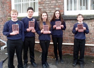 Fulford School students with the book 'Chocolate Factory'.