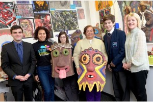 Tom (left) and Aimeth (third from right) with staff and students at Oasis Academy.