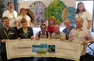 Yorkshire delegates in front of the conference logo display created by Holmfirth's 'Fair and Funky.'