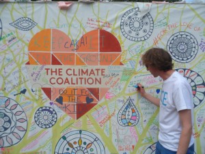 Richard Lane, Communications Officer of Fairtrade Yorkshire, adds his message to the display in Lambeth Palace Gardens.