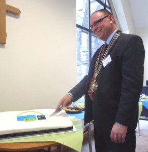 Chair of the Town Council, John Garvani cuts the cake